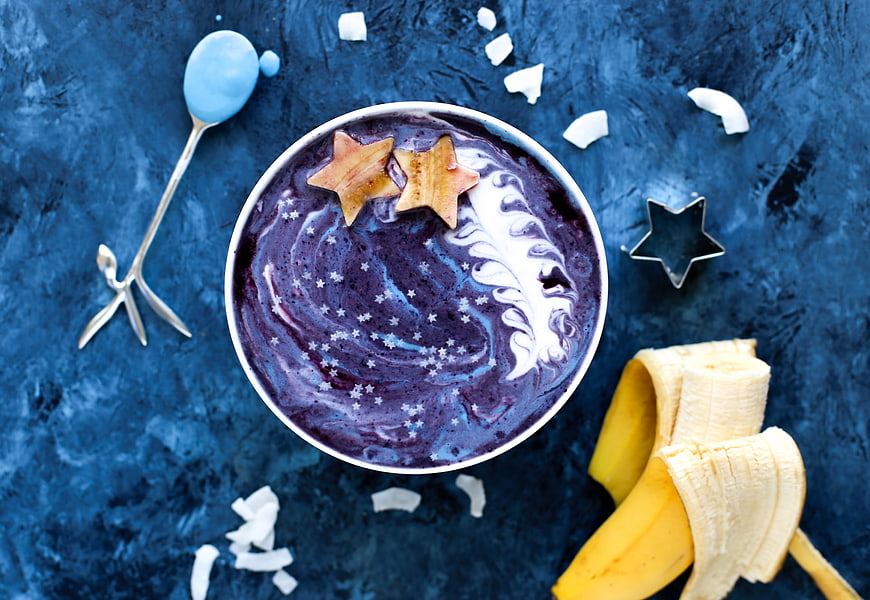 Blueberry smoothie bowl with banana and star toppings