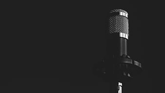 Close-up of vintage microphone on dark background