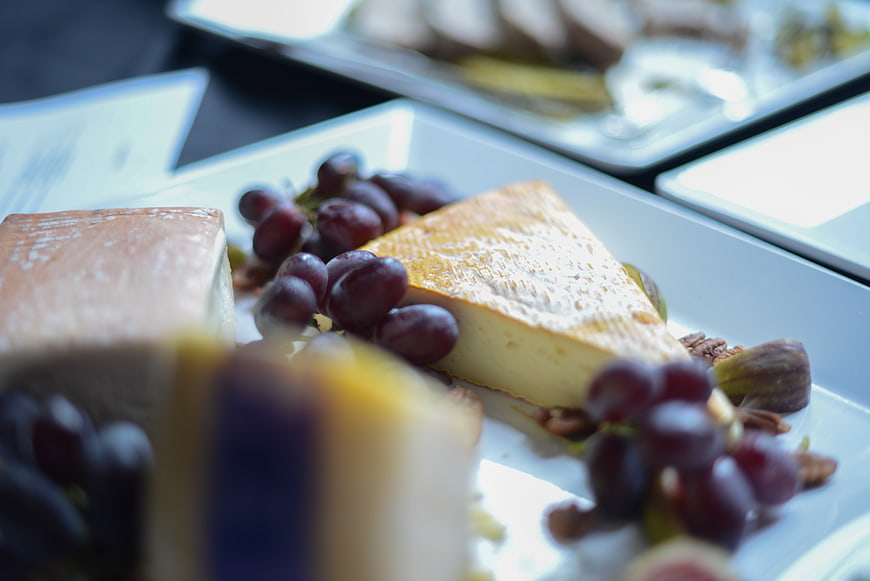 Artisanal cheese plate with grapes and figs