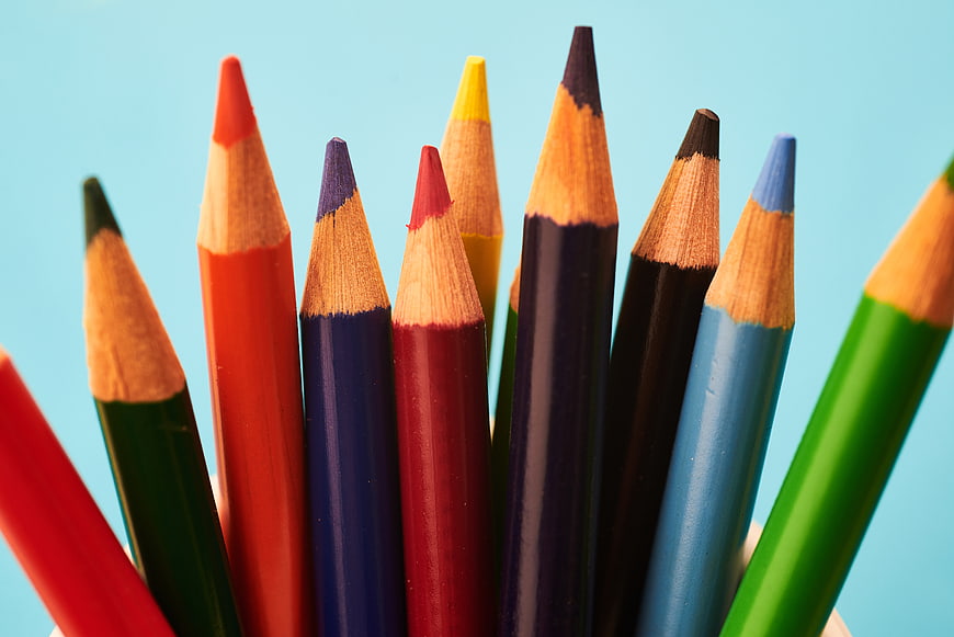 Close-up of colorful pencils on a blue background