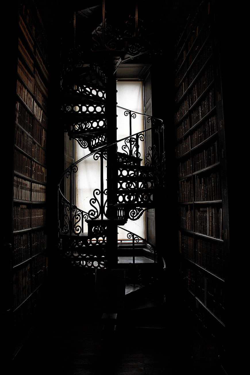 Dark Spiral Staircase in Vintage Library