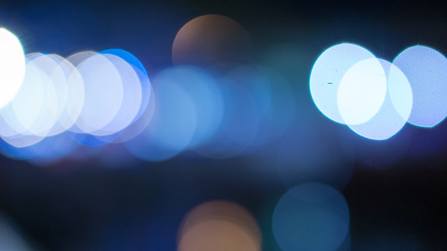 Abstract Blue Bokeh Lights Background at Night