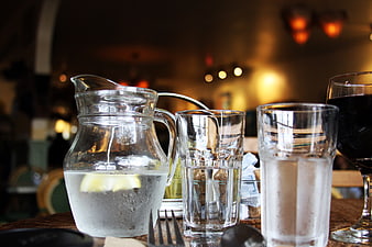 Water pitcher and glasses on restaurant table