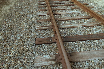 Rusty Railway Tracks on Gravel Ballast