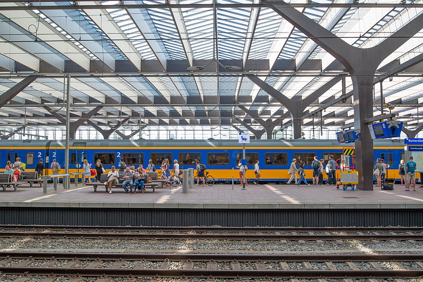 Blue and yellow train at Rotterdam Central Station platform