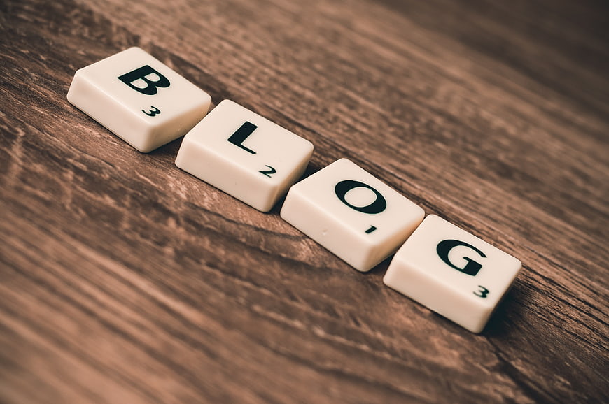 Scrabble Tiles Spelling Blog on Wooden Background