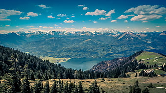 Panoramic Alpine Landscape with Lake and Snowy Peaks