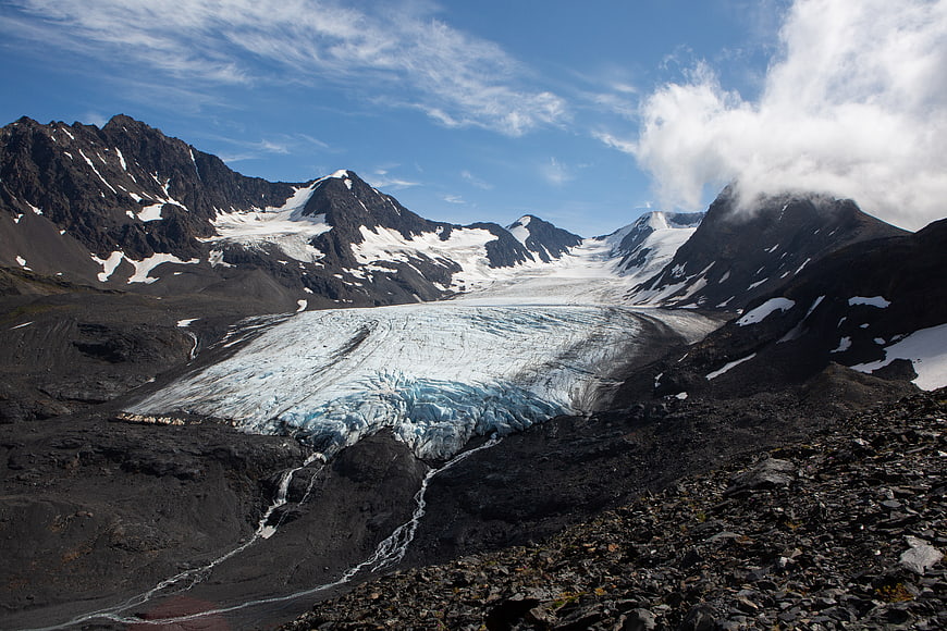 Majestic Glacier Valley with Snow-Capped Mountains and Blue Sky