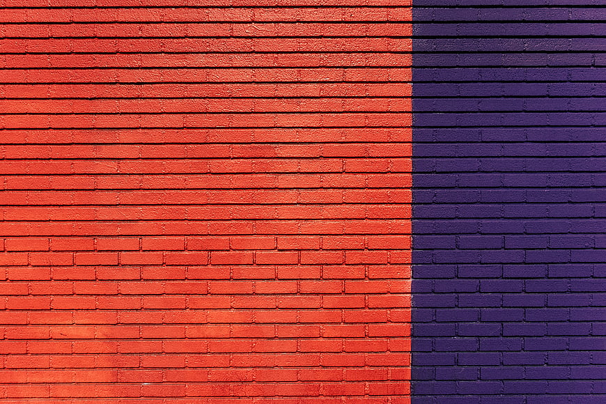 Vibrant Orange and Purple Brick Wall Texture Background