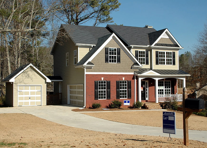 New Construction House with Red Brick and Beige Siding
