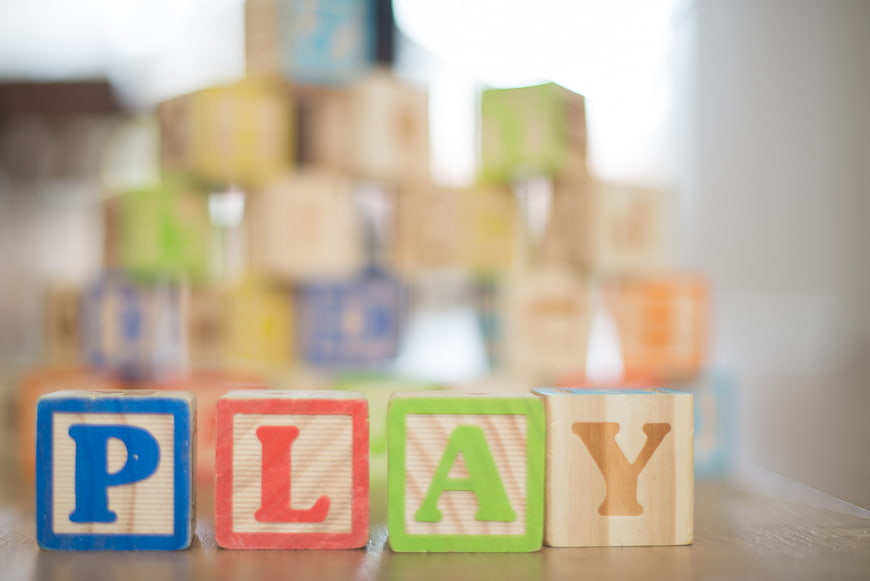 Wooden blocks spelling play with blurred background