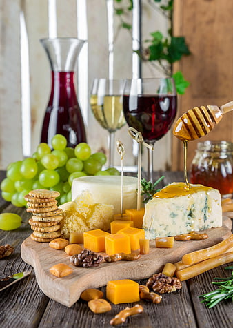 Artisanal Cheese Board with Wine, Grapes, and Honey