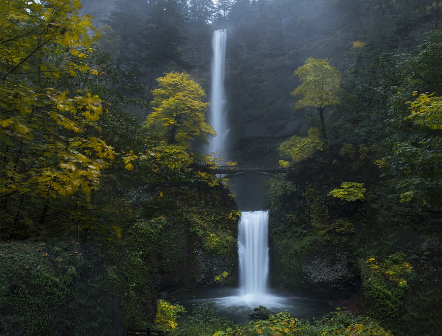 Misty Two-Tiered Waterfall in Lush Autumn Forest
