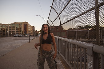 Stylish woman in urban street portrait at dusk