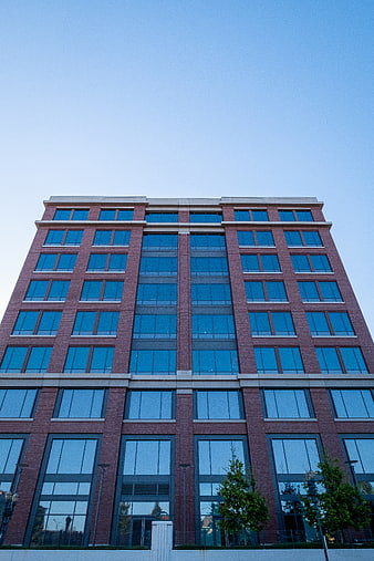 Low angle view of modern red brick office building