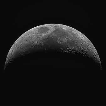 High-Resolution Crescent Moon with Craters on Black Background