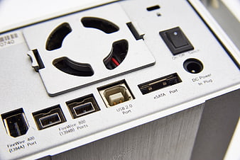 Close-up of computer external drive ports and power switch