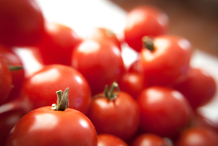 Close-up of fresh red cherry tomatoes with shallow depth of field