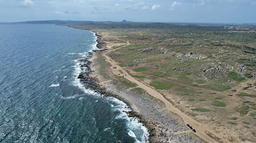 Aerial View of Rocky Coastal Landscape with Ocean Waves
