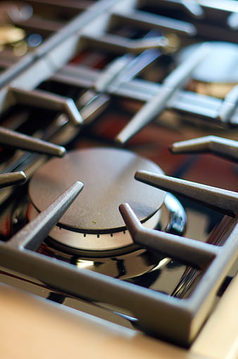 Close-up of modern gas stove burner and grates