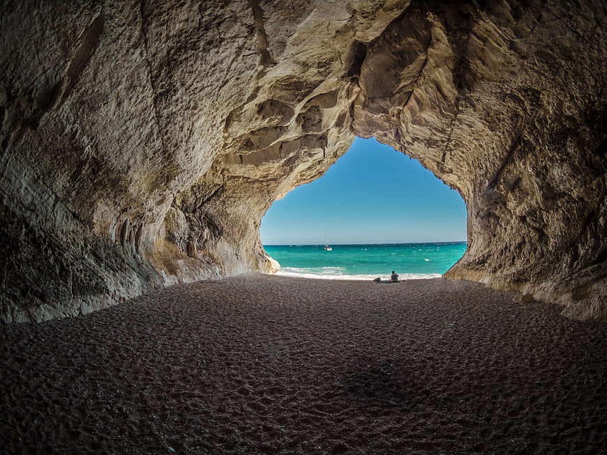 Secluded Beach Cave Opening to Turquoise Ocean