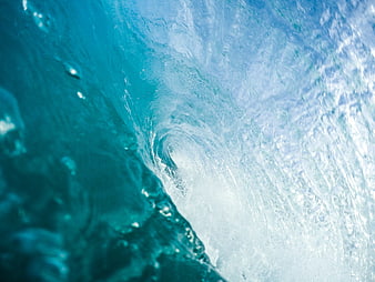 Underwater view of a curling ocean wave barrel