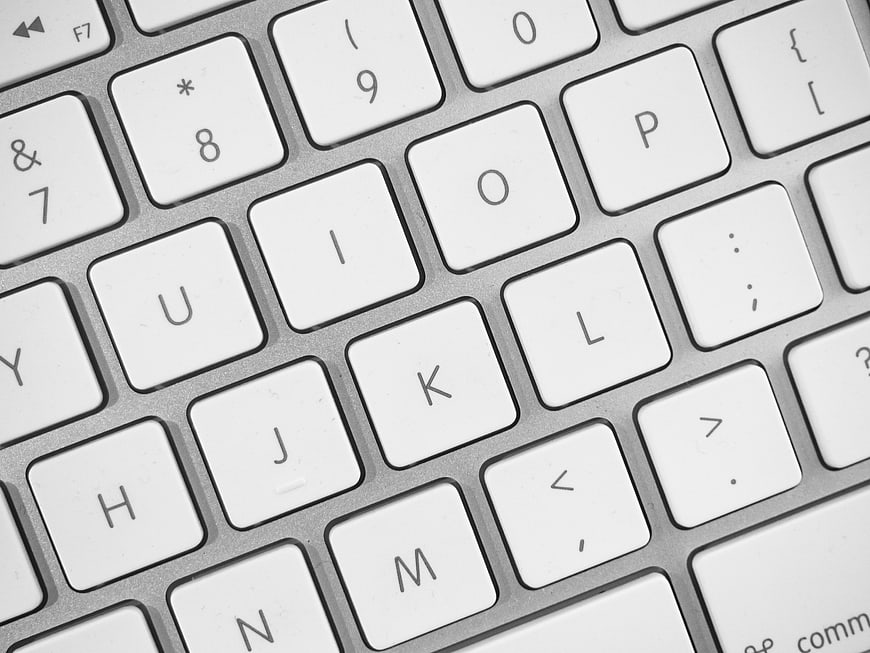 Close-up of white laptop keyboard keys