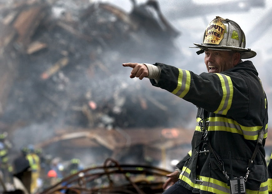 Firefighter Deputy Chief Pointing at Disaster Scene