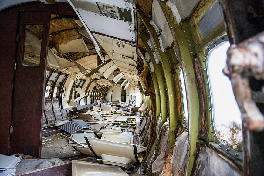 Interior of a wrecked airplane fuselage with debris