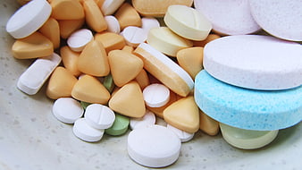 Assorted Colorful Medicine Pills and Tablets Close Up