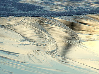 Abstract Close-Up of Wind-Sculpted Snow and Ice Patterns