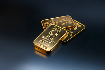 Stack of shiny gold bars on dark background