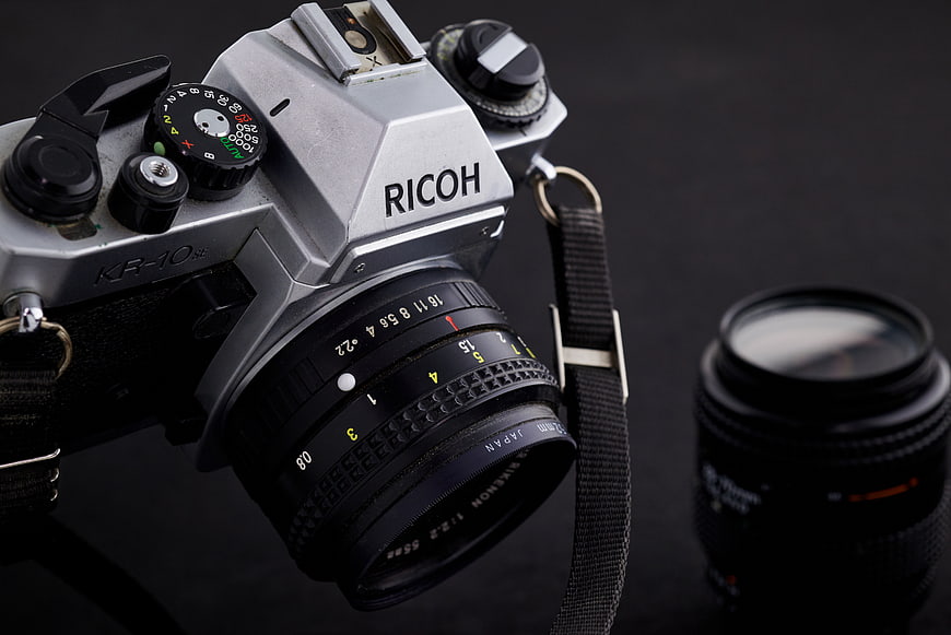 Vintage Ricoh KR-10 SLR Camera with Lens on Dark Background