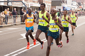Male marathon runners competing in street race