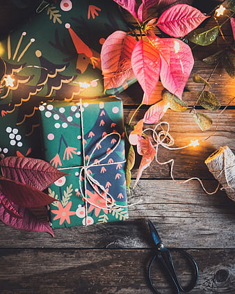 Rustic Christmas Gift Wrapping Flat Lay with Poinsettias