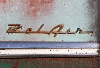 Vintage Bel Air Car Emblem with Rust and Chrome Detail