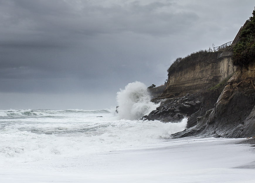Stormy Ocean Waves Crashing Against Rocky Cliffs