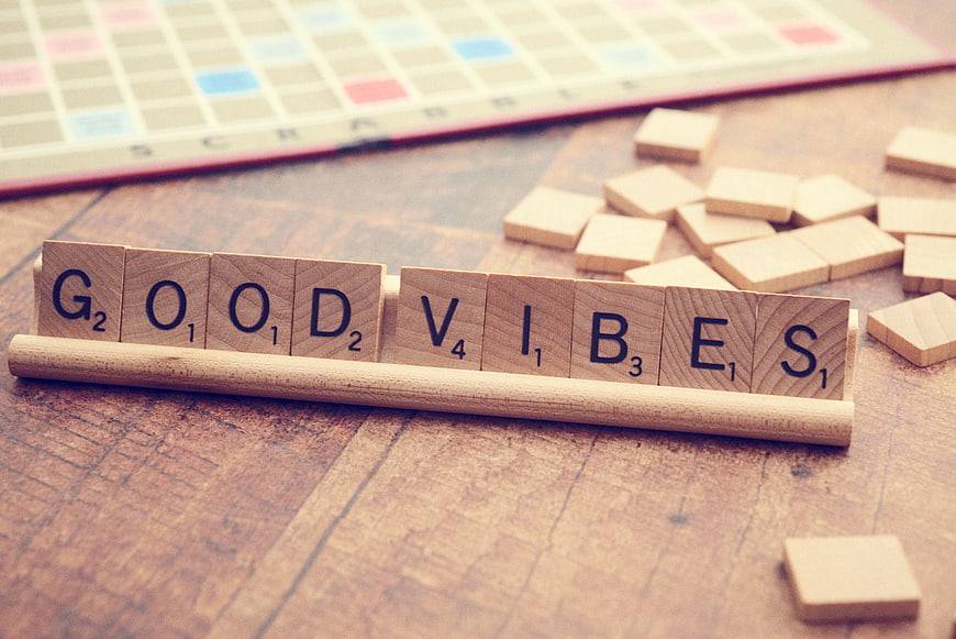 Good Vibes Scrabble Tiles on Wooden Table