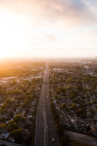 Aerial View of Highway at Sunset with Golden Hour Light