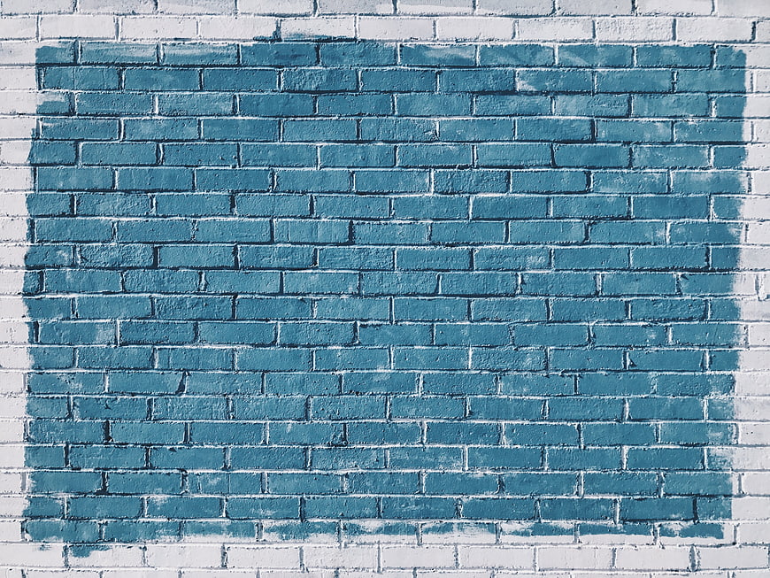 Blue painted brick wall texture background