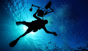 Silhouette of Scuba Diver with Underwater Camera Rig