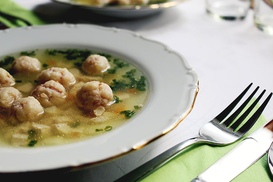 Delicious Meatball Soup in White Bowl with Gold Rim