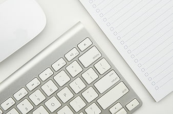 Minimalist Workspace with Keyboard and Notepad