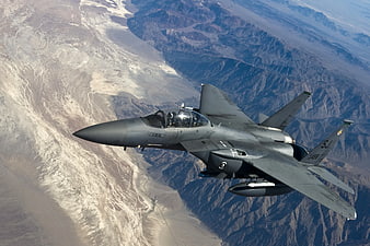 F-16 Fighting Falcon Jet Fighter Flying Over Desert Mountains