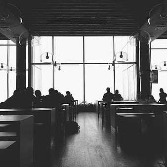 Silhouettes of People in Modern Cafeteria Interior