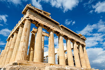 Low Angle View of the Parthenon Columns Against Blue Sky