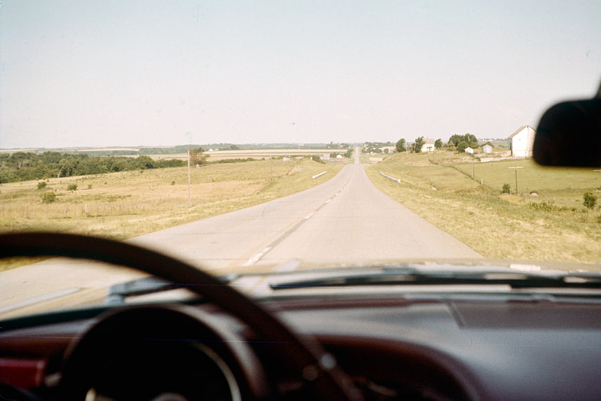 Vintage POV driving down rural highway