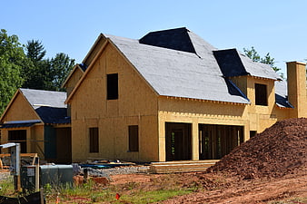 New House Construction Site with OSB Sheathing and Roofing
