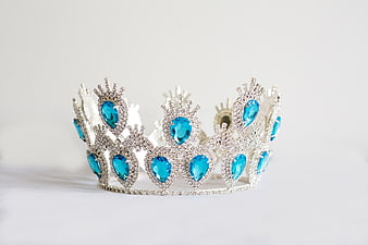 Silver Tiara with Blue Gemstones on White Background