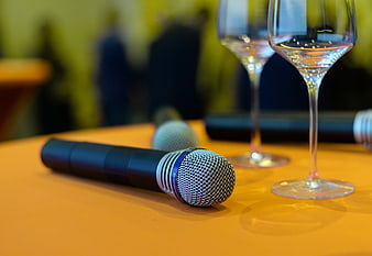 Microphone and wine glasses on a table